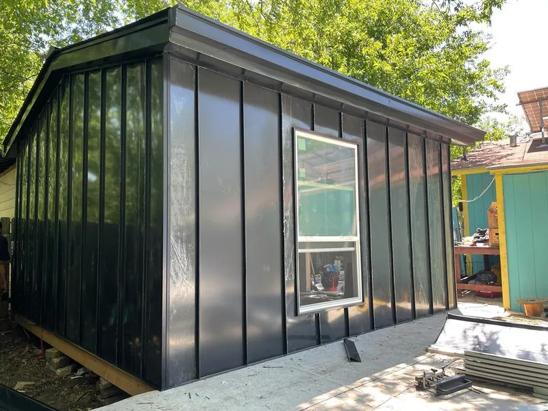 Black standing seam metal wall panels for Roof Inspection in Lino Lakes