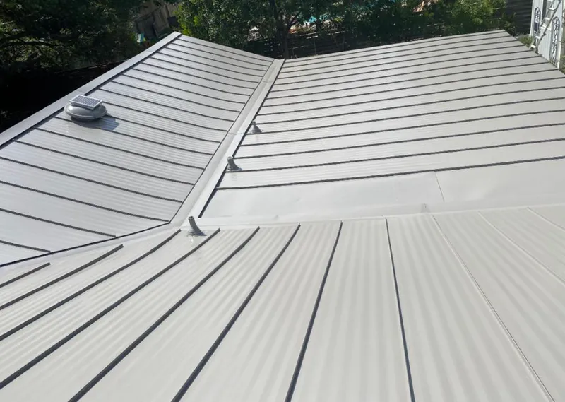 Solar attic fan installed on a metal roof for Roof Ventilation in Lino Lakes